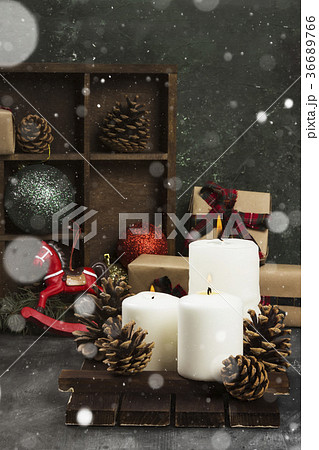 Burning candles and Christmas attributes 36689766