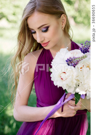 Bridesmaid with luxurious colorful wedding bouquet 36690655
