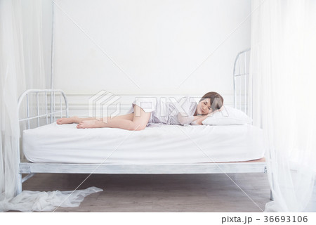Beautiful girl sleeping on bed 36693106