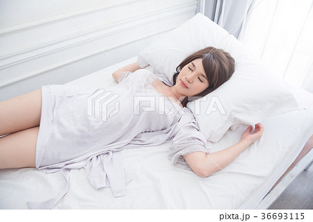 Beautiful girl sleeping on bed 36693115