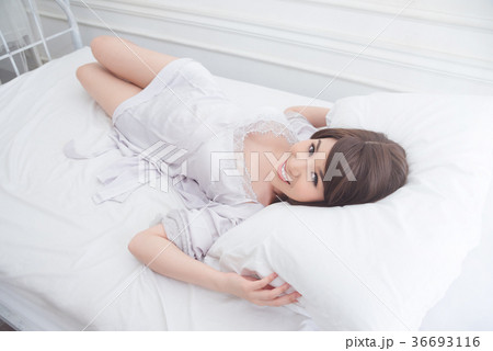 Beautiful girl smiling on bed 36693116