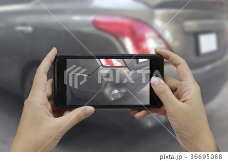 Hand holding smart phone take a photo 36695068