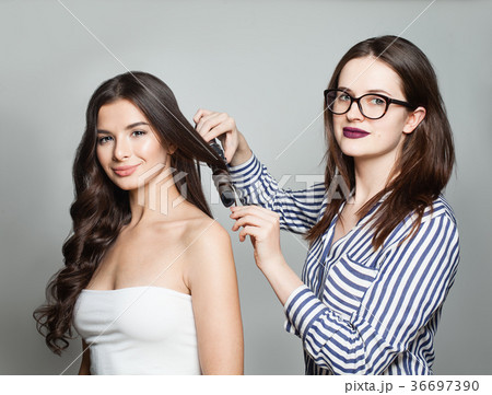 Hairdresser or Hairstylist Using Curler Hairdresser or Hairstylist Using Curler 36697390