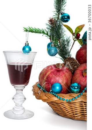 Pomegranates and a glass of red wine Pomegranates and a glass of red wine 36700033