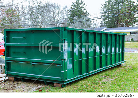 garbage container full of blue garbage bags 36702967