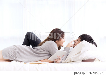 young asian couple in love hug each other on bed. young asian couple in love hug each other on bed. 36705623
