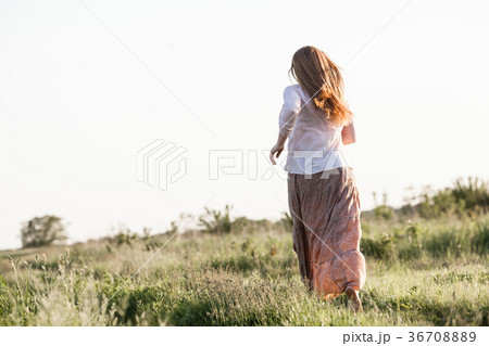 The girl ran across the field 36708889