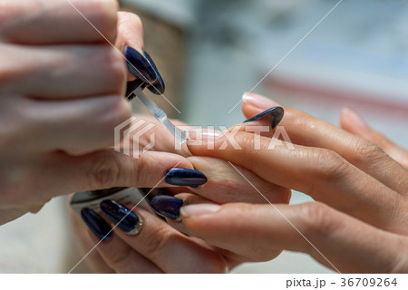 Manicure treatment at nail salon. Manicure treatment at nail salon. 36709264