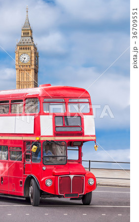 Big Ben with red bus in London, England, UK 36709551