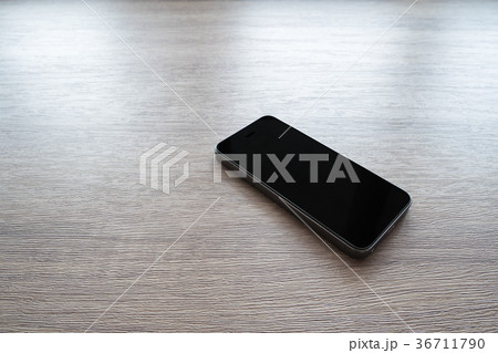 smart phone on wood table smart phone on wood table 36711790