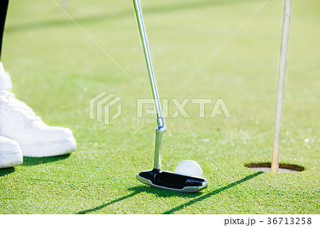 Golfer preparing to hit Golfer preparing to hit 36713258
