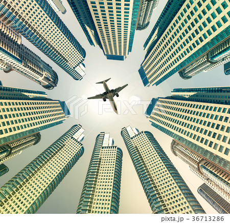 Plane encircled by buildings 36713286