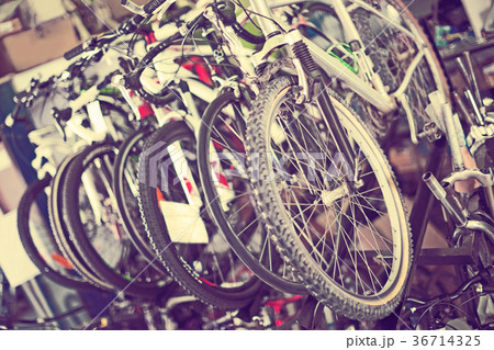 Image of colorful bicycles on showcase 36714325