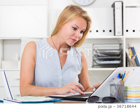 young business woman working on laptop in office 36718644