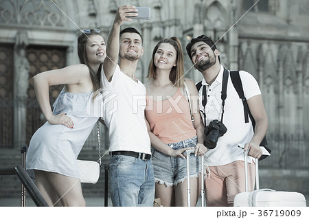 Joyful a group of friends doing selfies on the phon 36719009