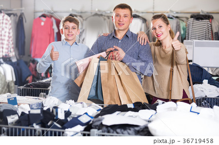 Parents with their son are pleased purchases Parents with their son are pleased purchases 36719458