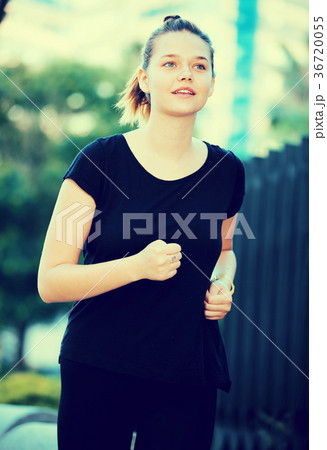 Girl jogging during outdoor workout Girl jogging during outdoor workout 36720055
