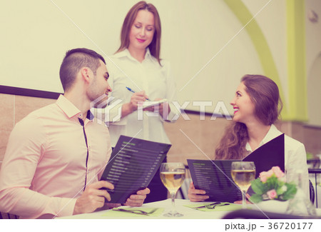 Couple making order in cafe 36720177