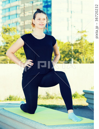 Young female during outdoor training yoga Young female during outdoor training yoga 36720232
