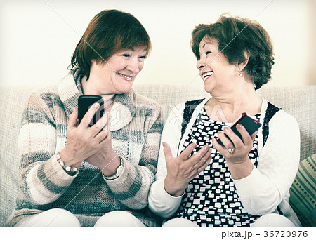 Senior women with mobile phones Senior women with mobile phones 36720976