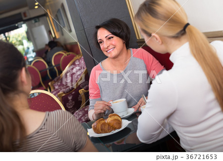 Female friends in the cafeteria. Female friends in the cafeteria. 36721653
