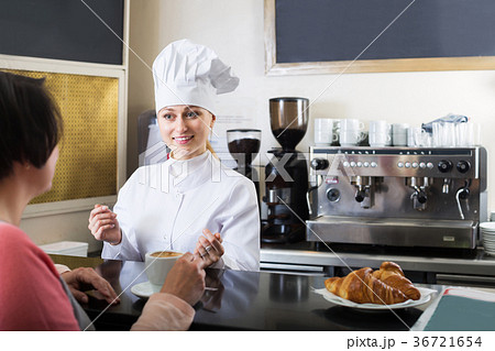 Cook selling pastry to customer 36721654