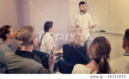 Male teacher giving presentation for students 36721659