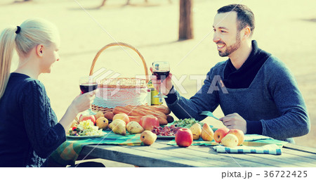 Couple drinking wine at table 36722425
