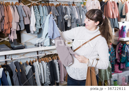 Woman chooses clothes in the store 36722611