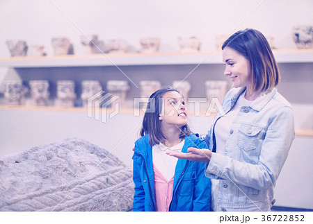 Mother and daughter regarding classical bas-reliefs 36722852