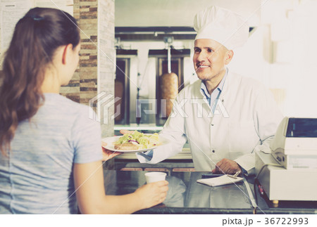 man chef giving order with kebab 36722993