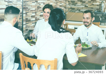 Group of friends having dinner 36724093