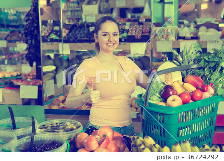 Woman with basket with fruits and vegetables 36724292
