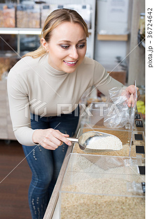 Blond woman choosing cereals 36724642