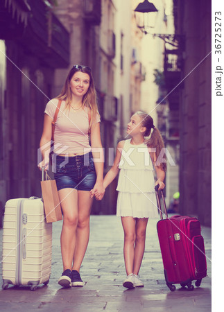 Mother with daughter travelers strolling Mother with daughter travelers strolling 36725273