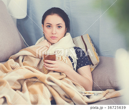 Ill girl wrapping in blanket 36725639