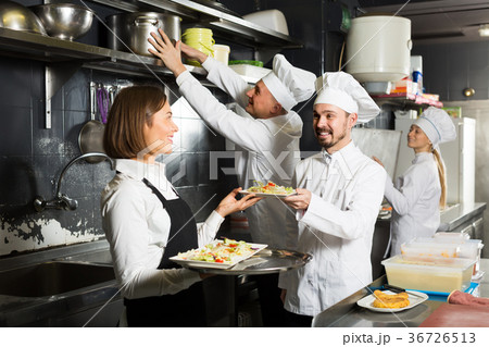 Beautiful female waiter taking ordered dishes 36726513