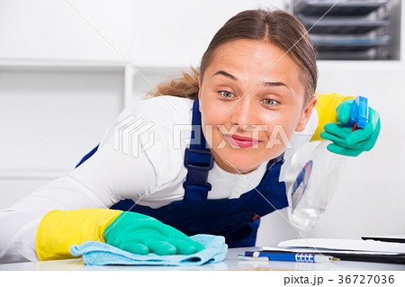 Woman cleaning at company office Woman cleaning at company office 36727036