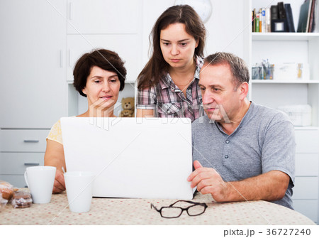 Senior couple with adult daughter Senior couple with adult daughter 36727240