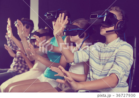 Parents with kids are watching video virtual reality 36727930