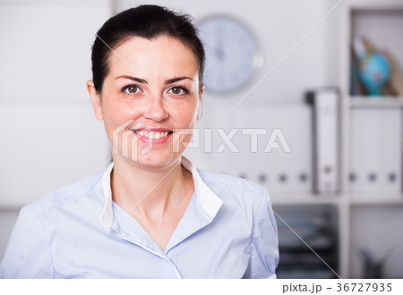 Portrait of young smiling woman in shirt Portrait of young smiling woman in shirt 36727935