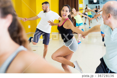 Dancing couples enjoying active swing Dancing couples enjoying active swing 36728136