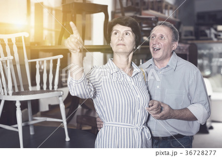 mature woman with her cheerful husband who are satisfied of buyi mature woman with her cheerful husband who are satisfied of buyi 36728277