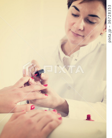 Woman doing manicure 36728353
