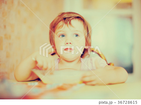 child himself eats from plate with spoon child himself eats from plate with spoon 36728615