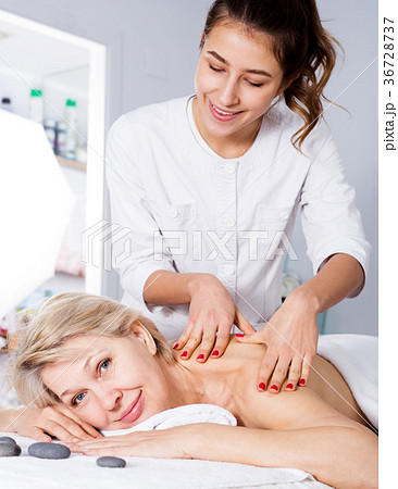 Woman having professional massage in spa salon 36728737