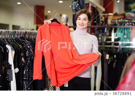Positive customer deciding on jersey cardigan 36728891