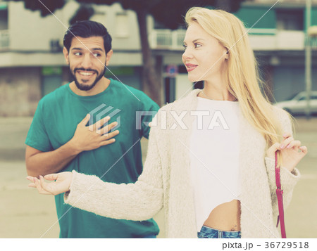 Female is talking with latino male Female is talking with latino male 36729518