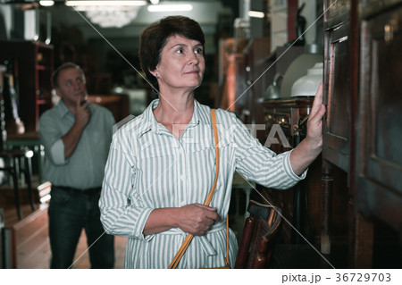 Mature woman is shopping the old buffet Mature woman is shopping the old buffet 36729703