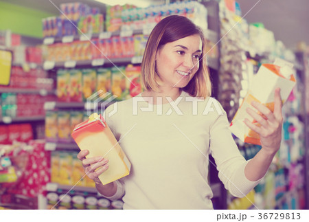Girl customer looking for refreshing beverages 36729813